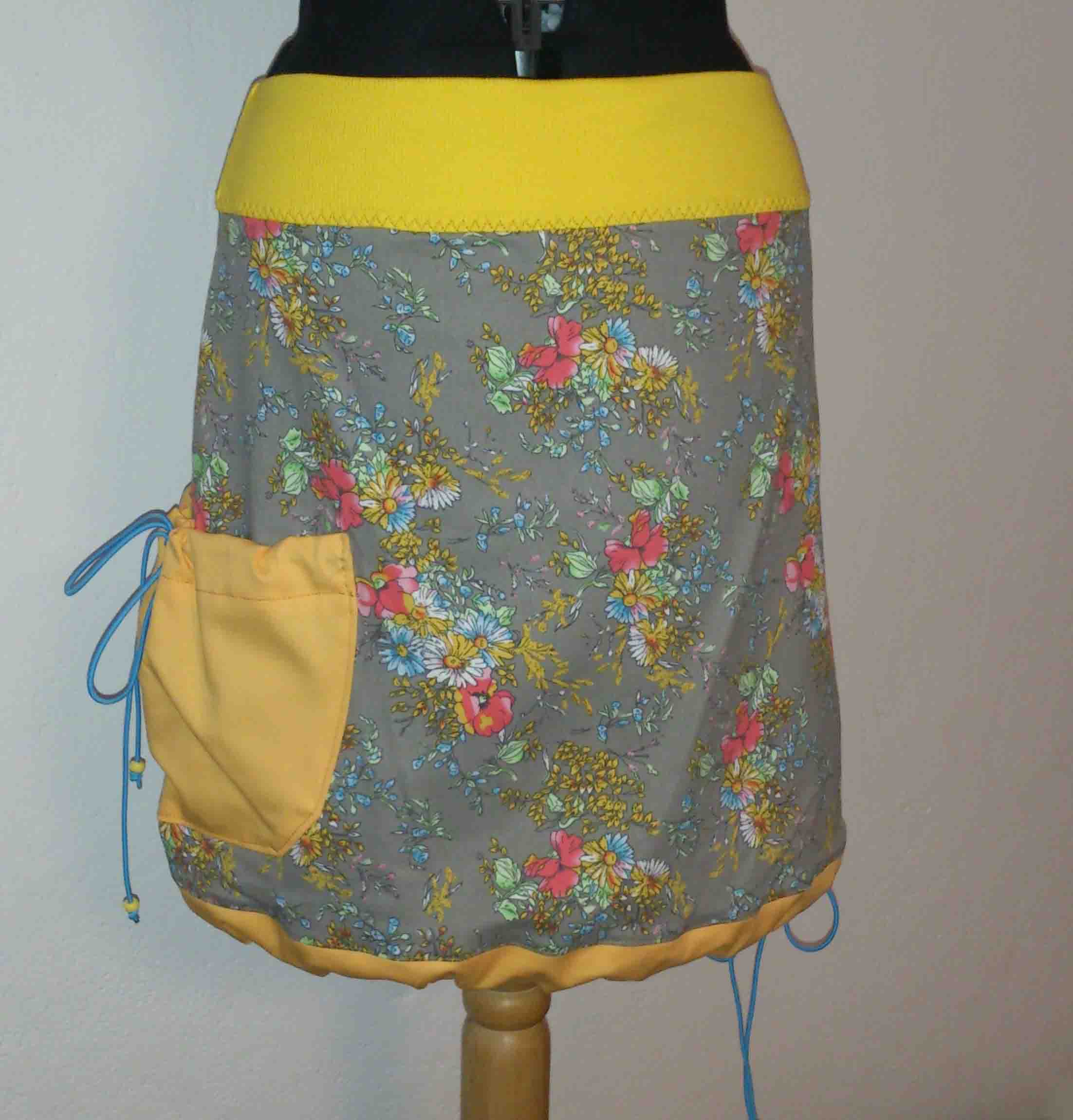 Dámská sukně s pružným pasem a kapsou